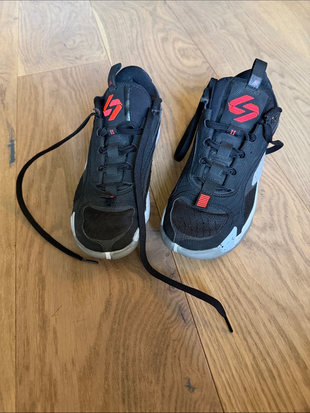Nike Kids Black Sneakers with Red Logo and Gray Accents